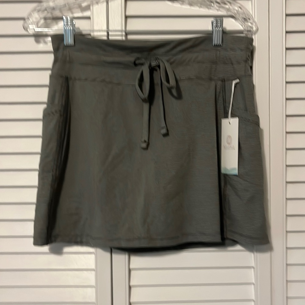 Great skirt. Comfy, casual. Goes with anything. Two pockets